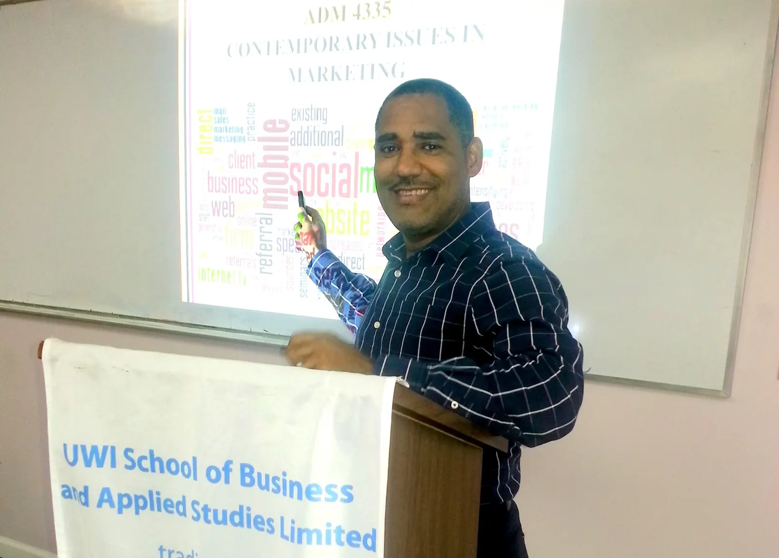 Kurtis Rudd lecturing a Contemporary Issues in Marketing class at UWI-ROYTEC